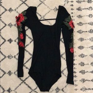 Long sleeved black body suit